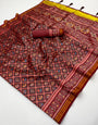 Cynosure Wine Printed Patola Handloom Silk Saree With Evanescent Blouse Piece