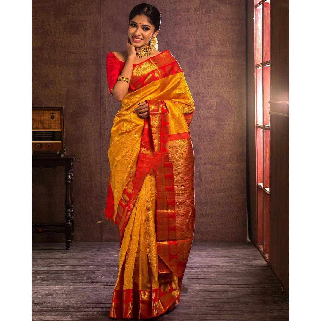 Impressive Yellow Soft Banarasi Silk Saree With Flattering Blouse Piece