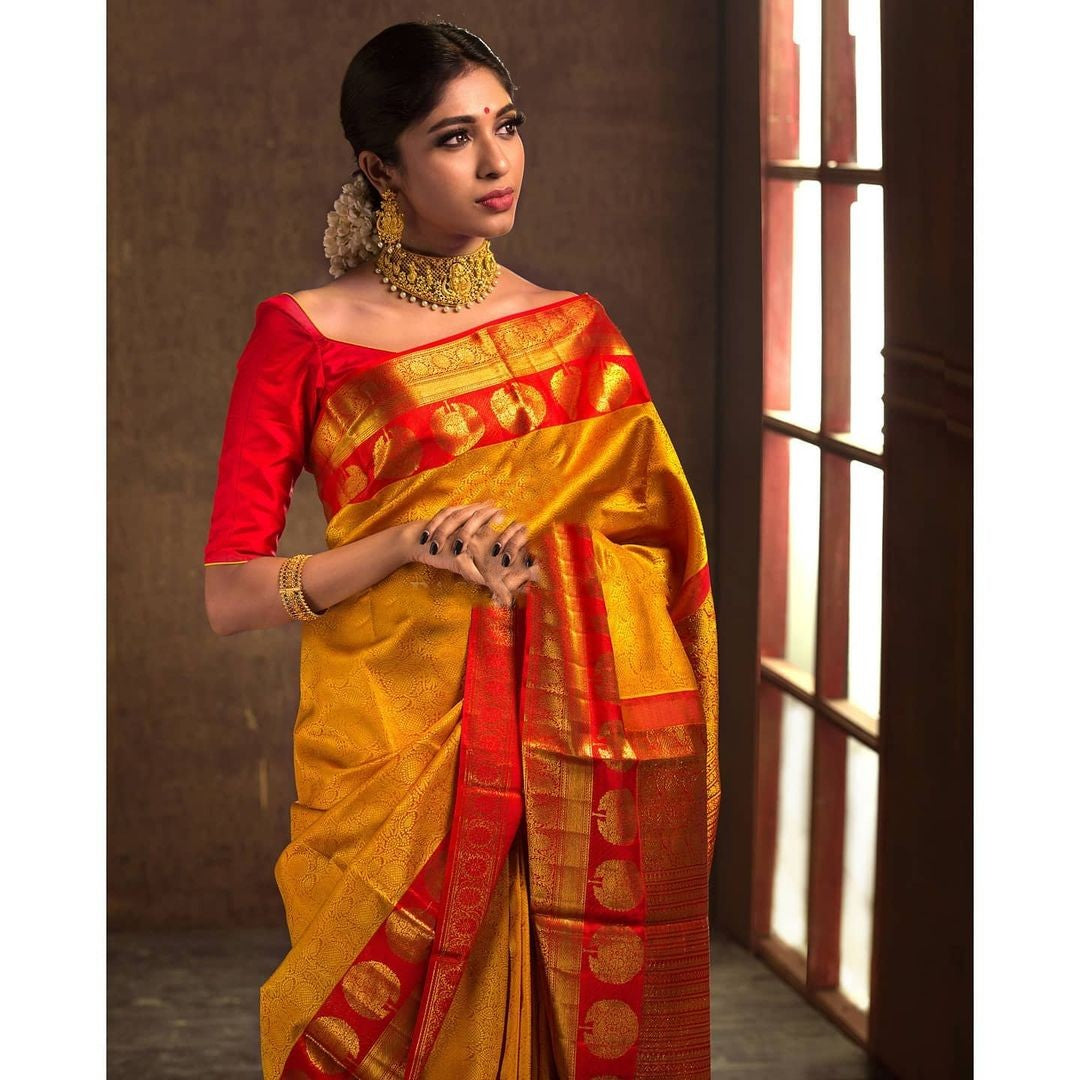 Impressive Yellow Soft Banarasi Silk Saree With Flattering Blouse Piece