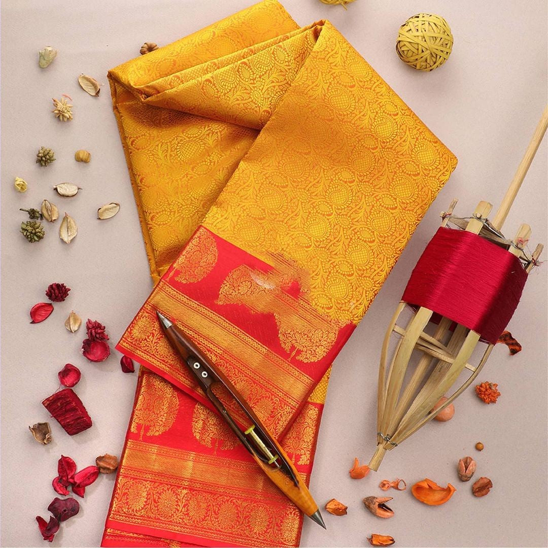 Impressive Yellow Soft Banarasi Silk Saree With Flattering Blouse Piece