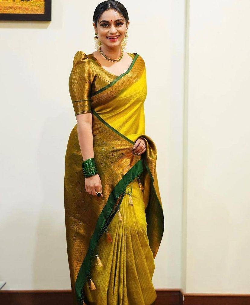 Moiety Yellow Soft Banarasi Silk Saree With Girlish Blouse Piece