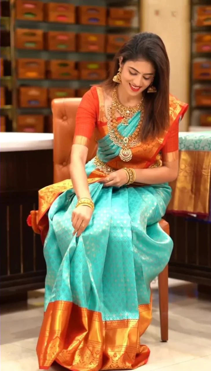 Enigmatic Turquoise Soft Silk Saree with Propinquity Blouse Piece