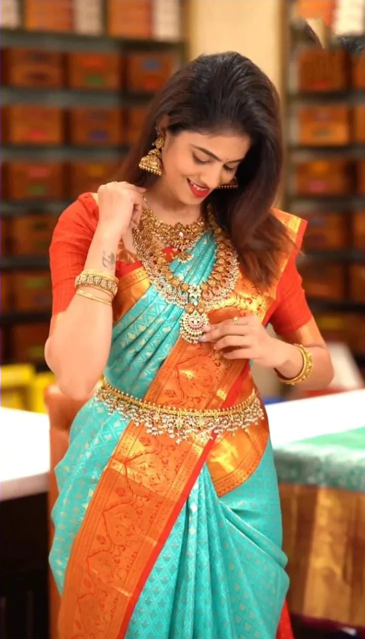 Enigmatic Turquoise Soft Silk Saree with Propinquity Blouse Piece