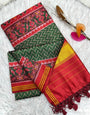 Winsome Dark Green Ikkat Printed Patola Silk Saree With Rhapsodic Blouse Piece