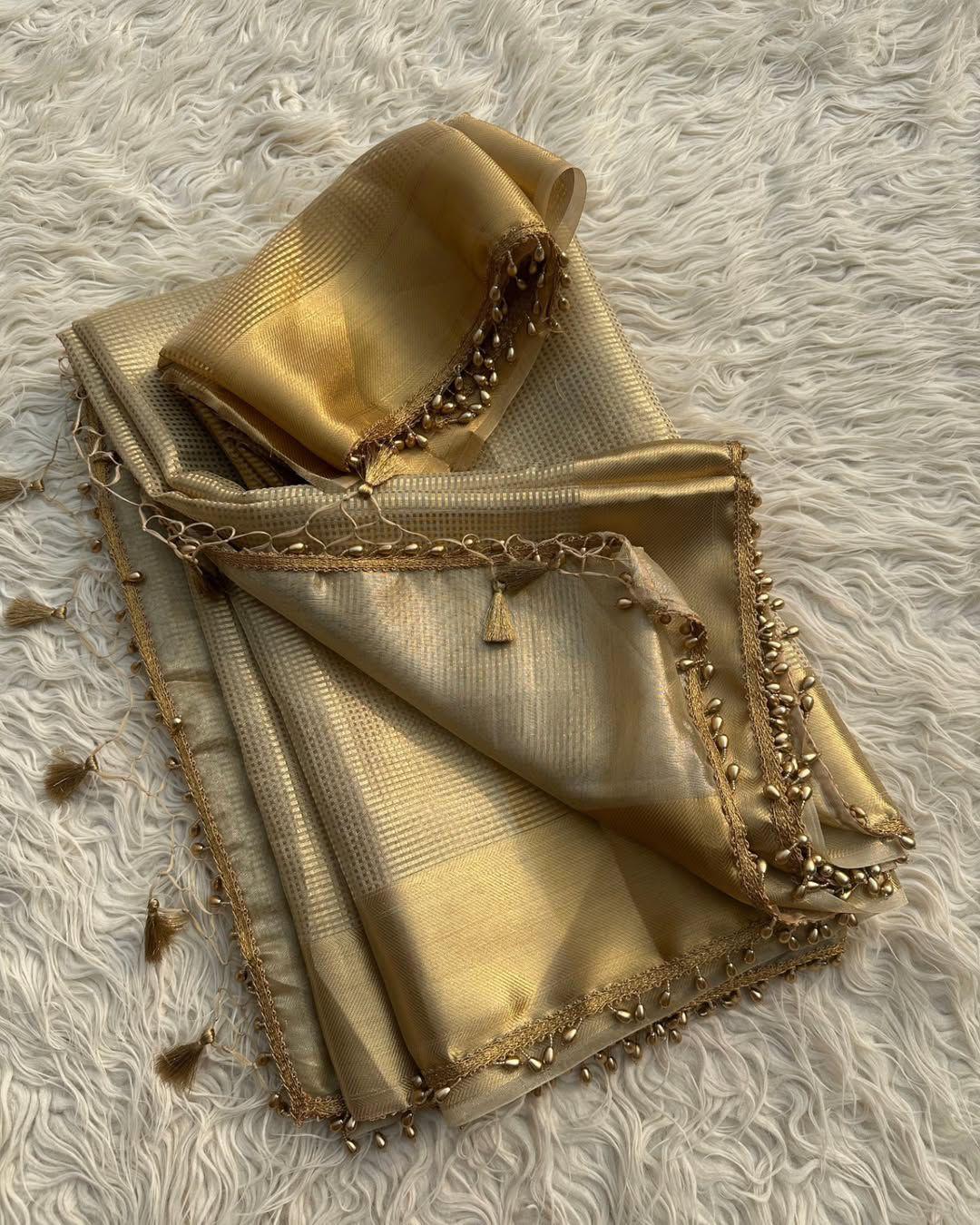 Dazzling Golden Soft Tissue Silk Saree With Zephyr Blouse Piece